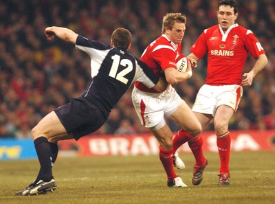 12.02.06 - Six Nations Rugby - Wales v Scotland Wales Matthew Watkins trries to get past Andrew Henderson 