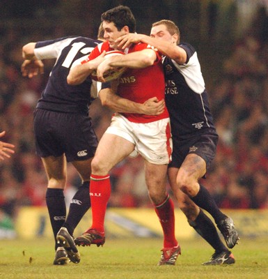 12.02.06 - Six Nations Rugby - Wales v Scotland Wales' Stephen Jones tries to get between Andrew Henderson and Dan Parks 