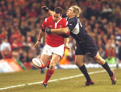 12.02.06 - Six Nations Rugby - Wales v Scotland Wales' Mark Jones is tackled by Sean Lamont as he chips ahead 