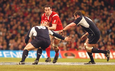 12.02.06 - Six Nations Rugby - Wales v Scotland Wales' Rob Sidoli tries to beat Ross Ford and Jason White 