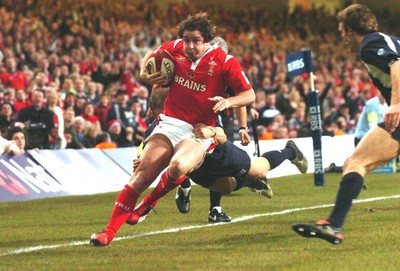 12.02.06  Wales v Scotland  Shane Williams is tackled by Ben MacDougall  