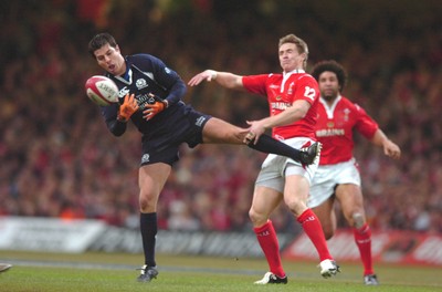 12.02.06  Wales v Scotland  Hugo Southwell loses the ball under pressure for Matthew Watkins  