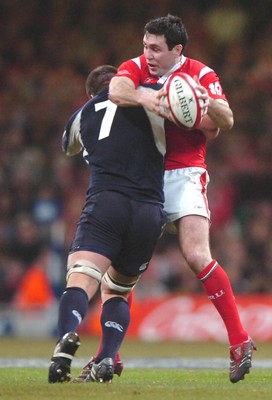 12.02.06  Wales v Scotland  Stephen Jones is tackled by Alister Hogg  