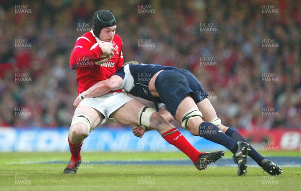 12.02.06..Wales v Scotland, Millennium Stadium, Cardiff Wales Michael Owen is tackled by Jason White 
