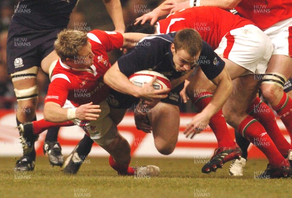 12.02.06 - Six Nations Rugby - Wales v Scotland Scotland's Andrew Henderson is brought down by Matthew Watkins 