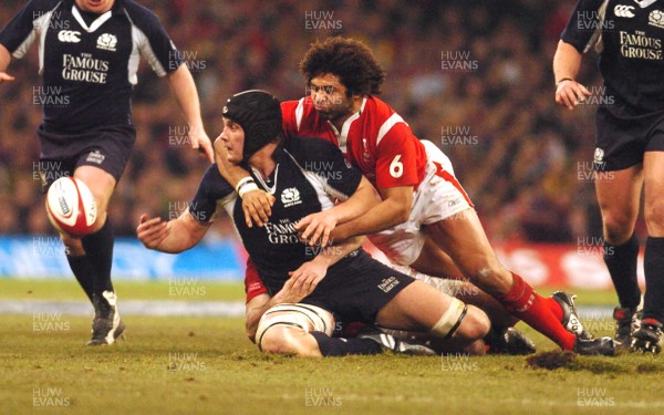 12.02.06 - Six Nations Rugby - Wales v Scotland Scotland's Alastair Kellock releases the ball as Colin Charvis tackles 