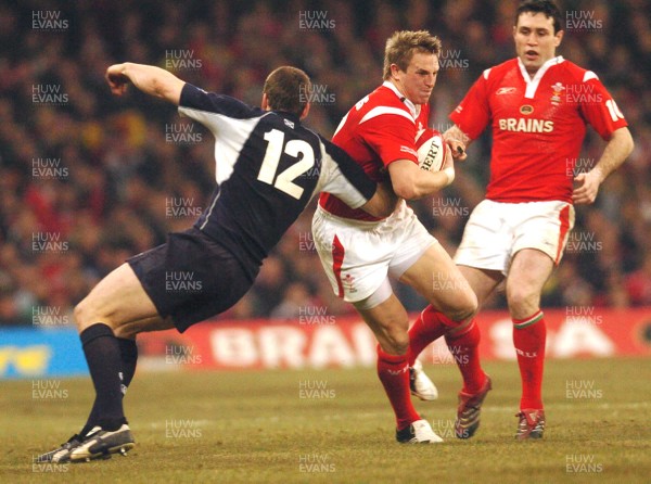 12.02.06 - Six Nations Rugby - Wales v Scotland Wales Matthew Watkins trries to get past Andrew Henderson 
