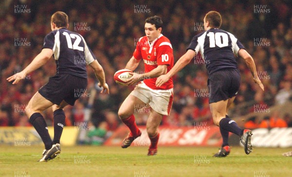 12.02.06 - Six Nations Rugby - Wales v Scotland Wales' Stephen Jones tries to get between Andrew Henderson and Dan Parks 