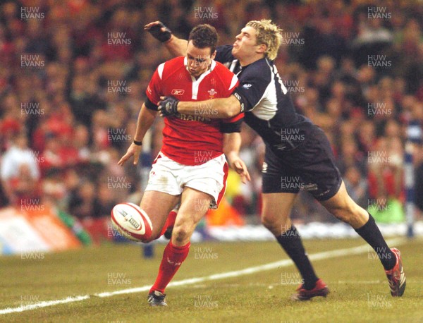 12.02.06 - Six Nations Rugby - Wales v Scotland Wales' Mark Jones is tackled by Sean Lamont as he chips ahead 