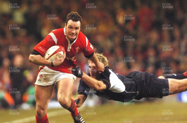 12.02.06 - Six Nations Rugby - Wales v Scotland Wales' Mark Jones tries to beat a Sean Lamont tackle 