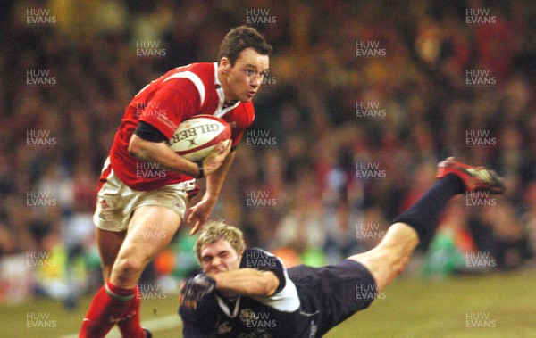 12.02.06 - Six Nations Rugby - Wales v Scotland Wales' Mark Jones beats a Sean Lamont tackle 