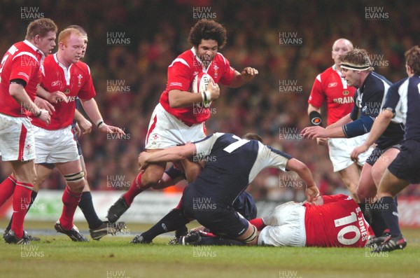 12.02.06  Wales v Scotland  Colin Charvis is tackled by Alister Hogg  