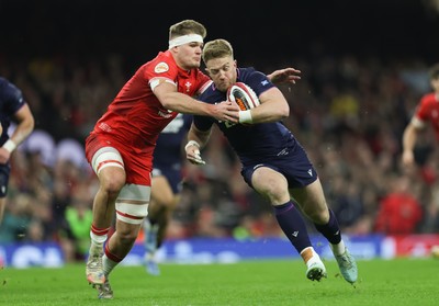 210226 - Wales v Scotland, 2026 Guinness Six Nations - Kyle Steyn of Scotland is tackled by Taine Plumtree of Wales