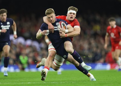 210226 - Wales v Scotland, 2026 Guinness Six Nations - Kyle Steyn of Scotland is tackled by Taine Plumtree of Wales