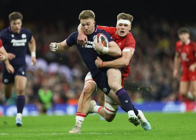 210226 - Wales v Scotland, 2026 Guinness Six Nations - Kyle Steyn of Scotland is tackled by Taine Plumtree of Wales