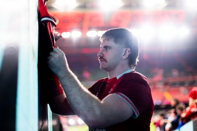 210226 - Wales v Scotland - Guinness Six Nations - Aaron Wainwright signs autographs for fans in the tunnel after the game 