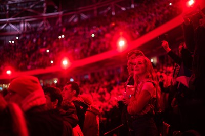 210226 - Wales v Scotland - Guinness Six Nations - Fans sing the Anthem under dramatic lighting