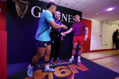 210226 - Wales v Scotland - Guinness Six Nations Championship - Captains Sione Tuipulotu of Scotland and Dewi Lake of Wales during the coin toss