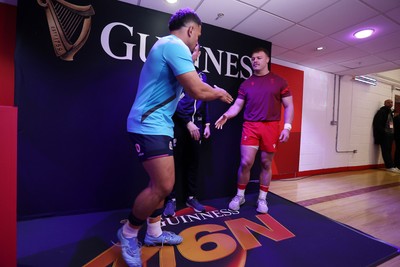 210226 - Wales v Scotland - Guinness Six Nations Championship - Captains Sione Tuipulotu of Scotland and Dewi Lake of Wales during the coin toss