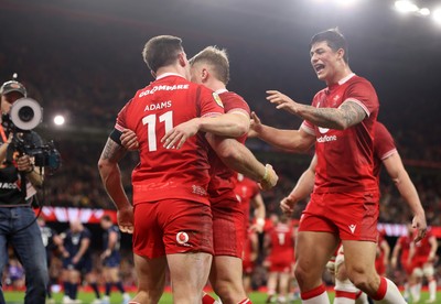210226 - Wales v Scotland - Guinness Six Nations Championship - Josh Adams of Wales celebrates scoring a try with team mates