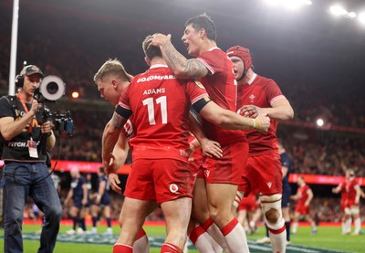 210226 - Wales v Scotland - Guinness Six Nations Championship - Josh Adams of Wales celebrates scoring a try with team mates