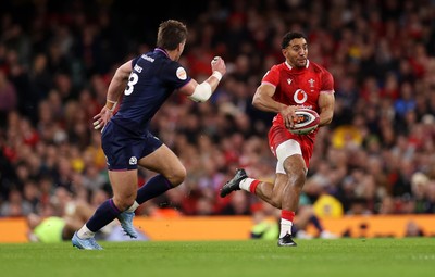 210226 - Wales v Scotland - Guinness Six Nations Championship - Gabriel Hamer-Webb of Wales is tackled by Huw Jones of Scotland 