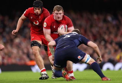 210226 - Wales v Scotland - Guinness Six Nations Championship - Rhys Carre of Wales is tackled by Scott Cummings of Scotland 