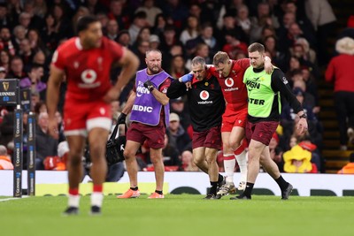 210226 - Wales v Scotland - Guinness Six Nations Championship - Sam Costelow of Wales goes off the field injured