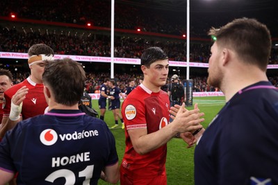 210226 - Wales v Scotland - Guinness Six Nations Championship - Louis Rees-Zammit of Wales shakes hands with the opposition at full time