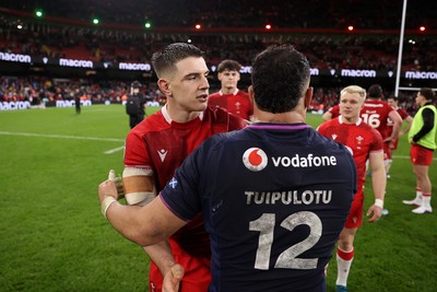 210226 - Wales v Scotland - Guinness Six Nations Championship - Joe Hawkins of Wales and Sione Tuipulotu of Scotland at full time
