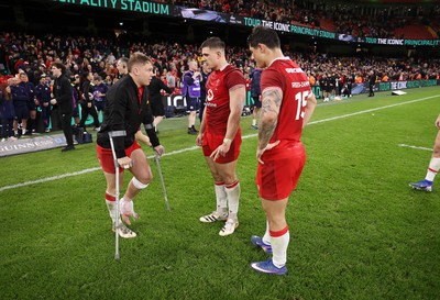 210226 - Wales v Scotland - Guinness Six Nations Championship - Sam Costelow, Joe Hawkins and Louis Rees-Zammit of Wales at full time