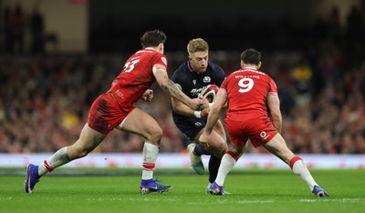 210226 - Wales v Scotland, 2026 Guinness Six Nations - Kyle Steyn of Scotland takes on Eddie James of Wales and Tomos Williams of Wales
