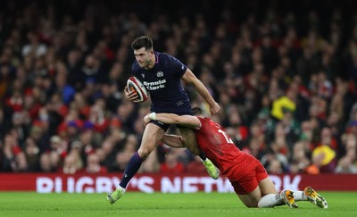 210226 - Wales v Scotland, 2026 Guinness Six Nations - Blair Kinghorn of Scotland is tackled by Joe Hawkins of Wales