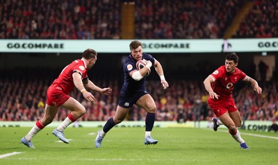 210226 - Wales v Scotland, 2026 Guinness Six Nations - Huw Jones of Scotland takes on Josh Adams of Wales and Louis Rees-Zammit of Wales