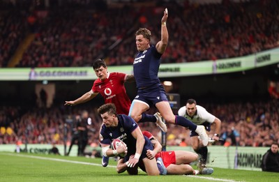 210226 - Wales v Scotland, 2026 Guinness Six Nations - Huw Jones of Scotland takes on Josh Adams of Wales and Louis Rees-Zammit of Wales