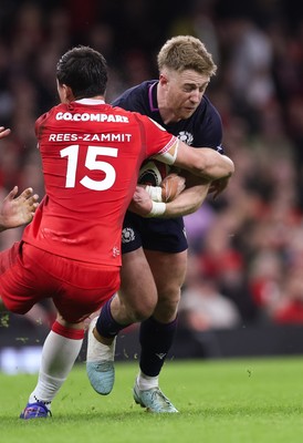 210226 - Wales v Scotland, 2026 Guinness Six Nations - Kyle Steyn of Scotland takes on Louis Rees-Zammit of Wales