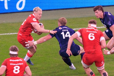 210226 - Wales v Scotland - Guinness Six Nations - Blair Murray of Wales is tackled by Kyle Steyn of Scotland