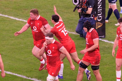 210226 - Wales v Scotland - Guinness Six Nations - Rhys Carre of Wales is congratulated by Louis Rees-Zammit after scoring a try