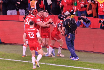 210226 - Wales v Scotland - Guinness Six Nations - Josh Adams of Wales celebrates with team mates after scoring a try