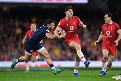 210226 - Wales v Scotland - Guinness Men's Six Nations - Eddie James of Wales is challenged by Ben White of Scotland