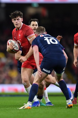 210226 - Wales v Scotland - Guinness Men's Six Nations - Eddie James of Wales is challenged by Finn Russell of Scotland