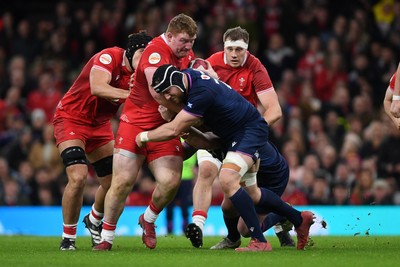 210226 - Wales v Scotland - Guinness Men's Six Nations - Rhys Carre of Walee is challenged by Rory Darge of Scotland
