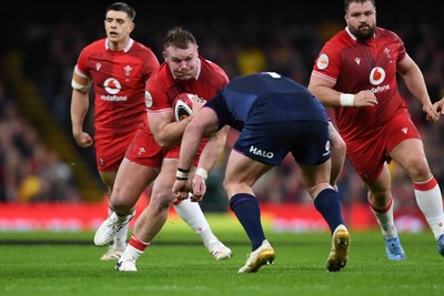 210226 - Wales v Scotland - Guinness Men's Six Nations - Dewi Lake of Wales is challenged by Nathan McBeth of Scotland