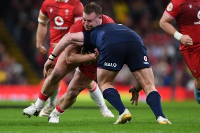 210226 - Wales v Scotland - Guinness Men's Six Nations - Dewi Lake of Wales is challenged by Nathan McBeth of Scotland