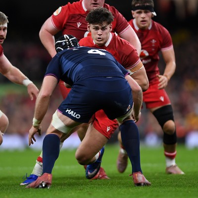 210226 - Wales v Scotland - Guinness Men's Six Nations - Eddie James of Wales is challenged by Max Williamson of Scotland