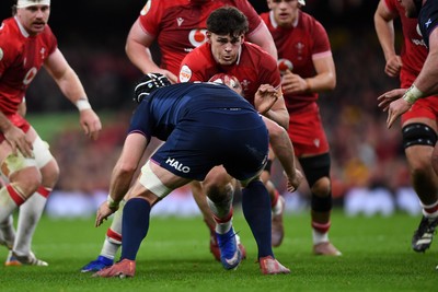 210226 - Wales v Scotland - Guinness Men's Six Nations - Eddie James of Wales is challenged by Max Williamson of Scotland