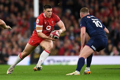 210226 - Wales v Scotland - Guinness Men's Six Nations -Joe Hawkins of Wales is challenged by Finn Russell of Scotland