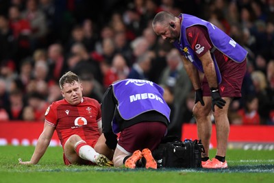 210226 - Wales v Scotland - Guinness Men's Six Nations - Sam Costelow of Wales leaves the field injured