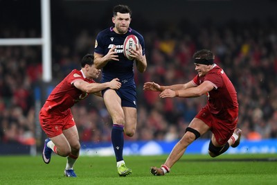 210226 - Wales v Scotland - Guinness Men's Six Nations - Blair Kinghorn of Scotland is challenged by Alex Mann of Wales
