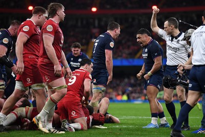 210226 - Wales v Scotland - Guinness Men's Six Nations - Sione Tuipulotu and Rory Darge of Scotland celebrates after George Turner of Scotland pushes the ball over to score a try